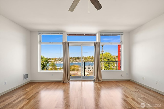 2960 Eastlake Ave E Unit 307, Seattle, WA 98102 - unfurnished room with plenty of natural light, light wood-style floors, and a ceiling fan
