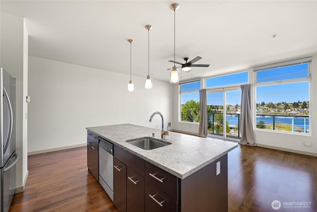 2960 Eastlake Ave E Unit 307, Seattle, WA 98102 - kitchen with a sink, ceiling fan, appliances with stainless steel finishes, dark brown cabinetry, and dark wood finished floors
