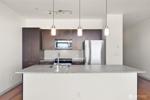 2960 Eastlake Ave E Unit 307, Seattle, WA 98102 - kitchen with appliances with stainless steel finishes, a sink, a kitchen island with sink, and light countertops