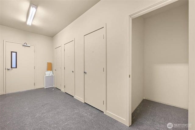 2960 Eastlake Ave E Unit 307, Seattle, WA 98102 - unfurnished bedroom featuring multiple closets and dark carpet