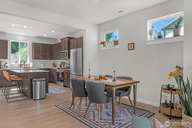 13125 13th Ave W Unit 6, Everett, WA 98204 - dining area featuring plenty of natural light, light wood-style flooring, recessed lighting, and baseboards