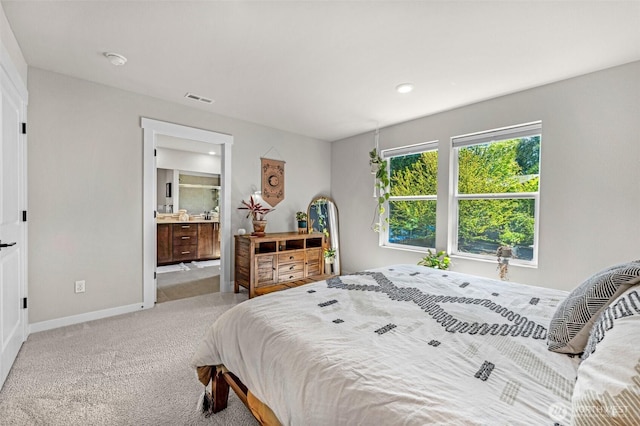 13125 13th Ave W Unit 6, Everett, WA 98204 - bedroom with light carpet, baseboards, ensuite bath, and recessed lighting