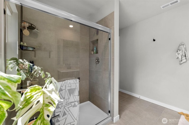 13125 13th Ave W Unit 6, Everett, WA 98204 - bathroom featuring a shower stall, tile patterned flooring, and baseboards