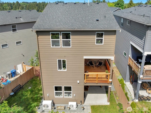 13125 13th Ave W Unit 6, Everett, WA 98204 - rear view of house with a patio, ac unit, a fenced backyard, and roof with shingles