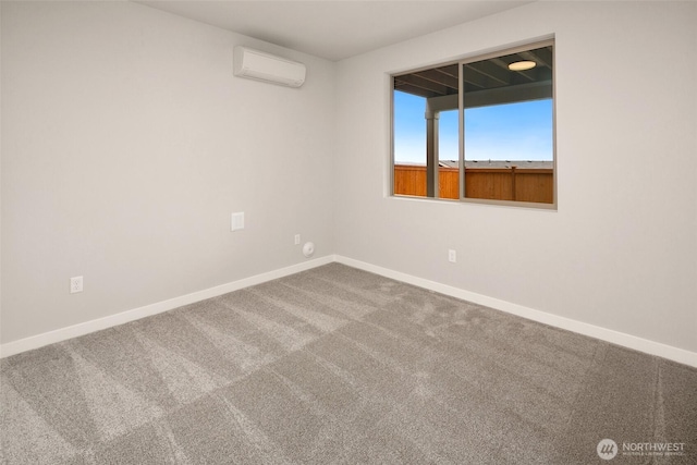 carpeted empty room featuring an AC wall unit and baseboards