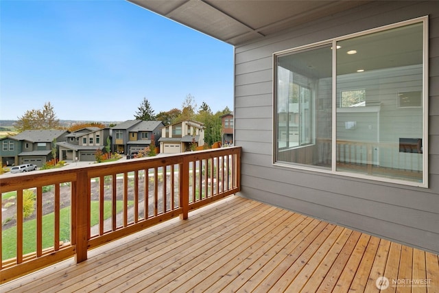 wooden terrace featuring a residential view