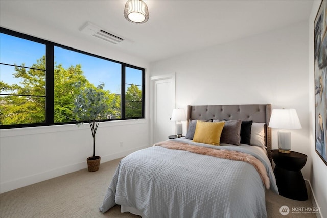 bedroom featuring carpet flooring and baseboards