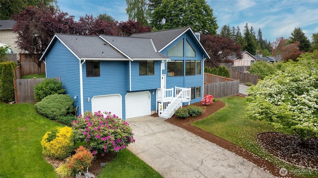 18323 23rd Dr SE, Bothell, WA 98012 - view of front of house featuring concrete driveway, a garage, roof with shingles, and stairs