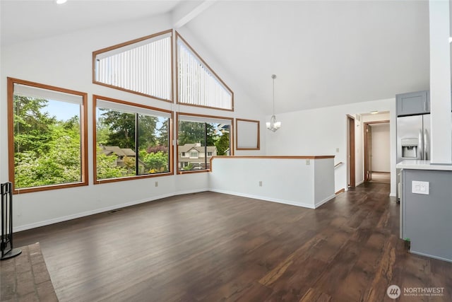 18323 23rd Dr SE, Bothell, WA 98012 - unfurnished living room with high vaulted ceiling, dark wood-style flooring, a chandelier, baseboards, and beam ceiling