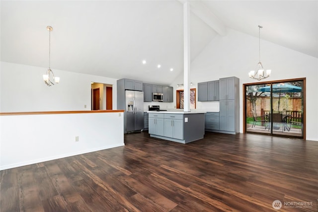18323 23rd Dr SE, Bothell, WA 98012 - kitchen with a chandelier, appliances with stainless steel finishes, gray cabinetry, high vaulted ceiling, and a center island