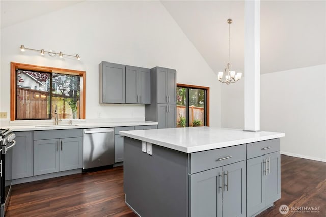 18323 23rd Dr SE, Bothell, WA 98012 - kitchen with gray cabinets, dishwasher, a sink, high vaulted ceiling, and a chandelier