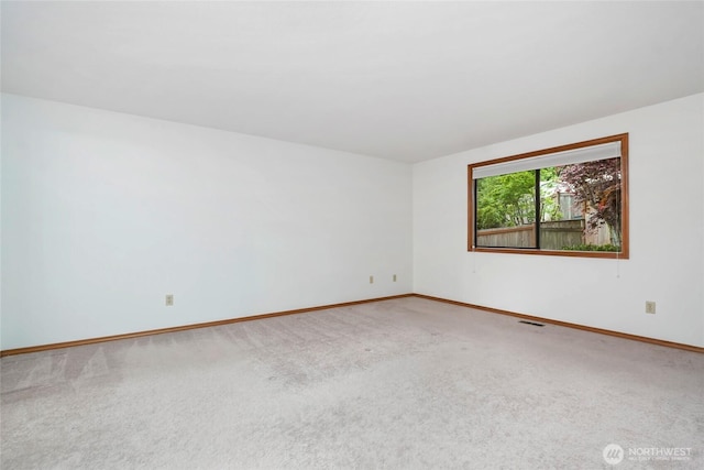 18323 23rd Dr SE, Bothell, WA 98012 - carpeted empty room with baseboards