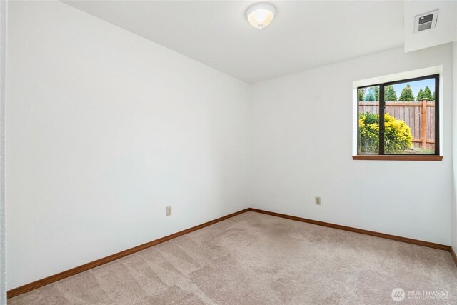 18323 23rd Dr SE, Bothell, WA 98012 - carpeted spare room with baseboards