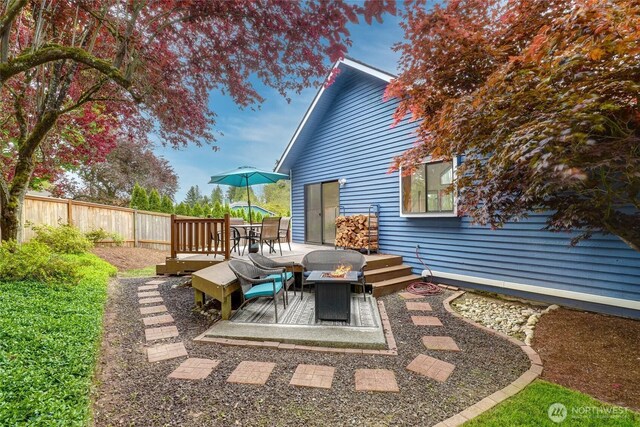 18323 23rd Dr SE, Bothell, WA 98012 - view of patio / terrace with a fire pit, fence, and a wooden deck