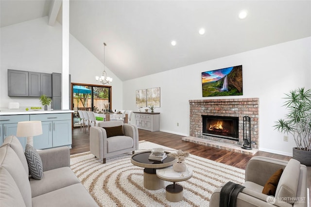 18323 23rd Dr SE, Bothell, WA 98012 - living area featuring high vaulted ceiling, a chandelier, wood finished floors, beamed ceiling, and a fireplace