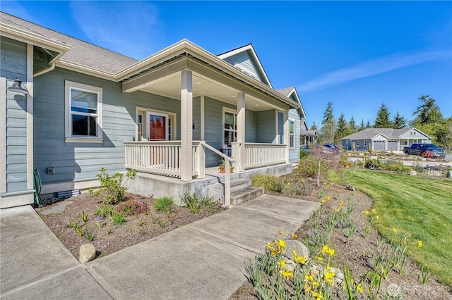 view of front of property featuring covered porch and a front yard