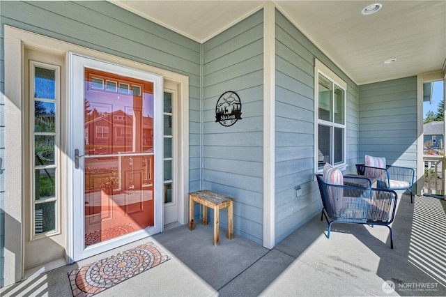 doorway to property with covered porch
