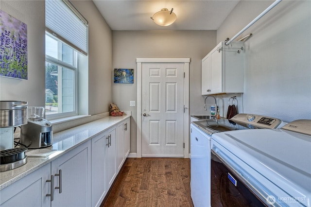 laundry room featuring independent washer and dryer and dark wood finished floors