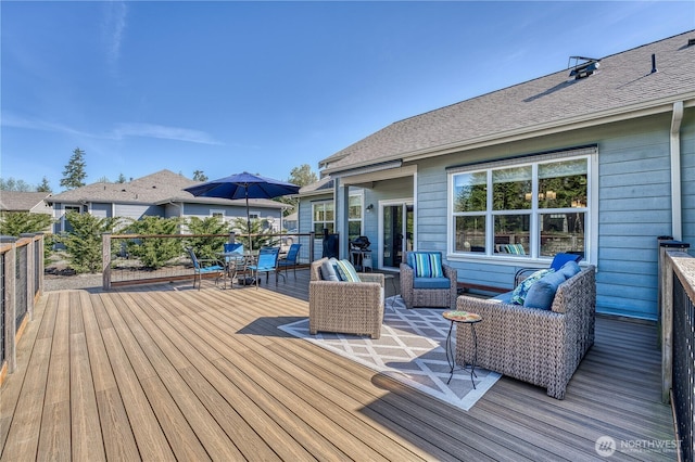 wooden terrace with outdoor dining space