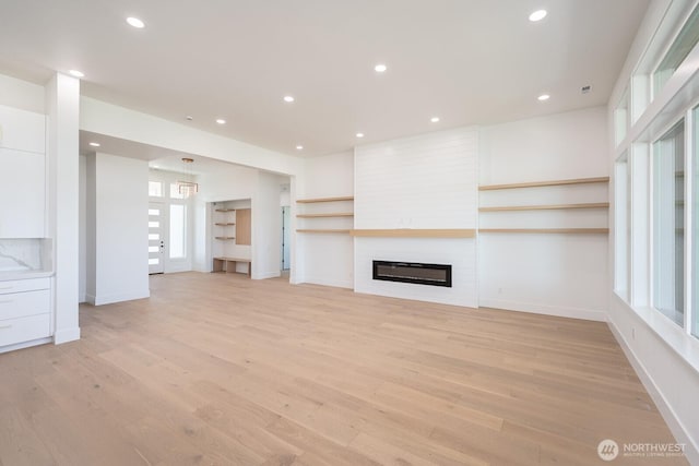 6773 Rd E.2 NE, Moses Lake, WA 98837 - unfurnished living room featuring light wood finished floors, a large fireplace, baseboards, and recessed lighting