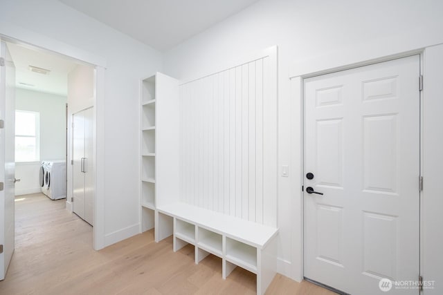 6773 Rd E.2 NE, Moses Lake, WA 98837 - mudroom featuring washer and clothes dryer, light wood-style floors, and baseboards