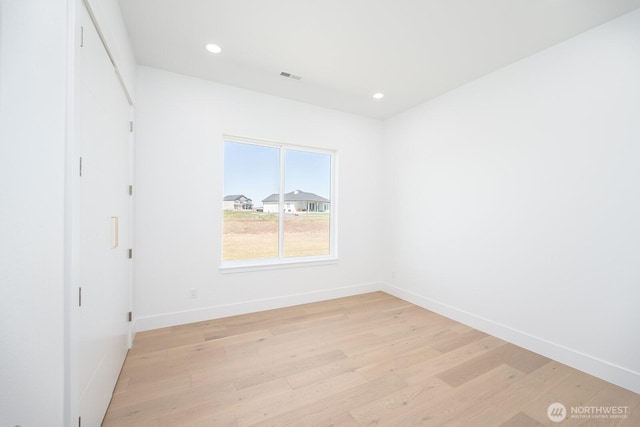 6773 Rd E.2 NE, Moses Lake, WA 98837 - unfurnished bedroom featuring light wood-style floors, baseboards, and recessed lighting