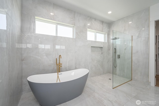6773 Rd E.2 NE, Moses Lake, WA 98837 - bathroom with a soaking tub, tile walls, a marble finish shower, and marble tiled flooring