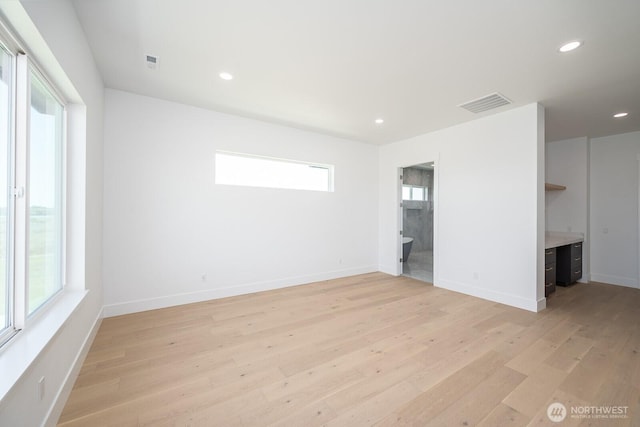 6773 Rd E.2 NE, Moses Lake, WA 98837 - unfurnished bedroom featuring light wood finished floors, recessed lighting, ensuite bathroom, and baseboards
