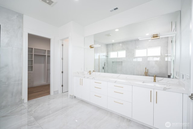 6773 Rd E.2 NE, Moses Lake, WA 98837 - full bath featuring a stall shower, a spacious closet, double vanity, and marble finish floors