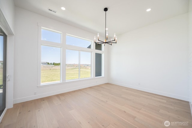 6773 Rd E.2 NE, Moses Lake, WA 98837 - spare room featuring a chandelier, baseboards, light wood finished floors, and recessed lighting