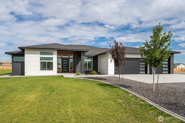 6773 Rd E.2 NE, Moses Lake, WA 98837 - prairie-style home featuring an attached garage, concrete driveway, and a front yard