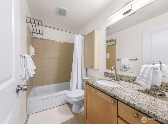 full bathroom featuring toilet, tile patterned flooring, vanity, and shower / bath combination with curtain