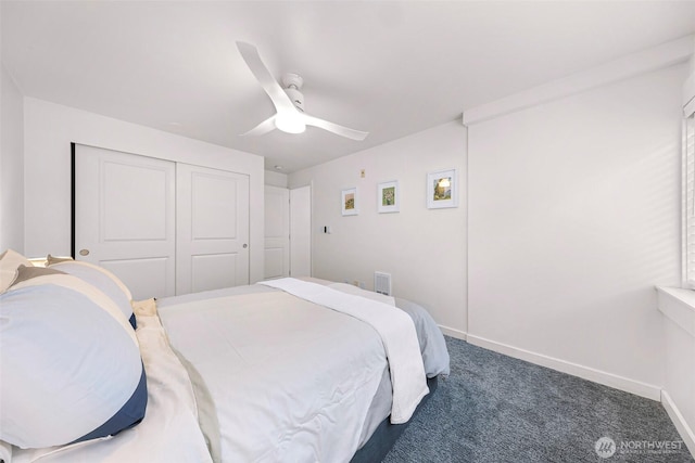 carpeted bedroom featuring baseboards, ceiling fan, and a closet