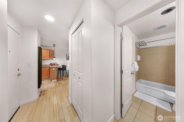 hallway with light wood-type flooring