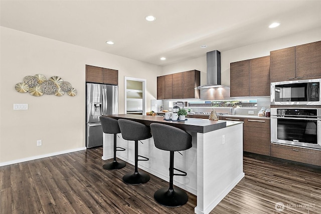 30429 121st Pl SE, Auburn, WA 98092 - kitchen with stainless steel appliances, wall chimney exhaust hood, a kitchen bar, modern cabinets, and a kitchen island