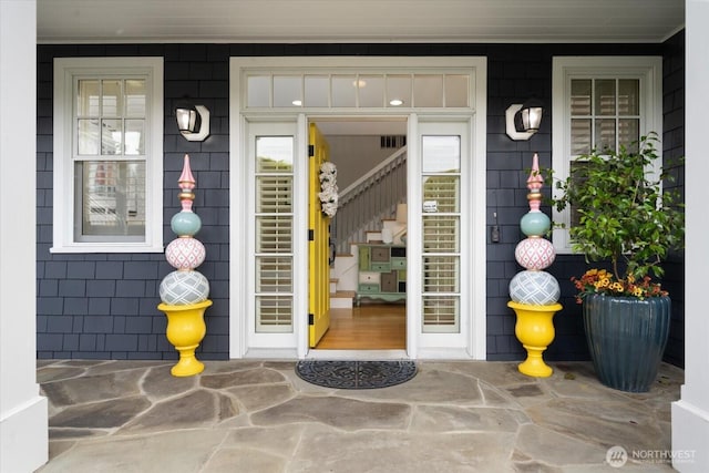 property entrance featuring a porch