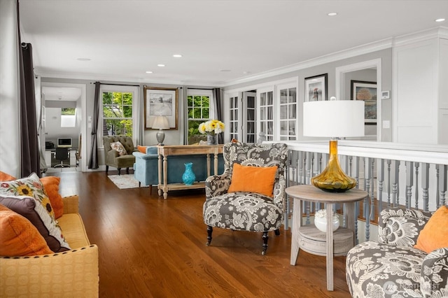 sitting room with crown molding, wood finished floors, and recessed lighting