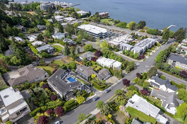 aerial perspective of suburban area with a nearby body of water