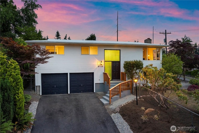 8716 Main St, Edmonds, WA 98026 - view of front of house with an attached garage and asphalt driveway