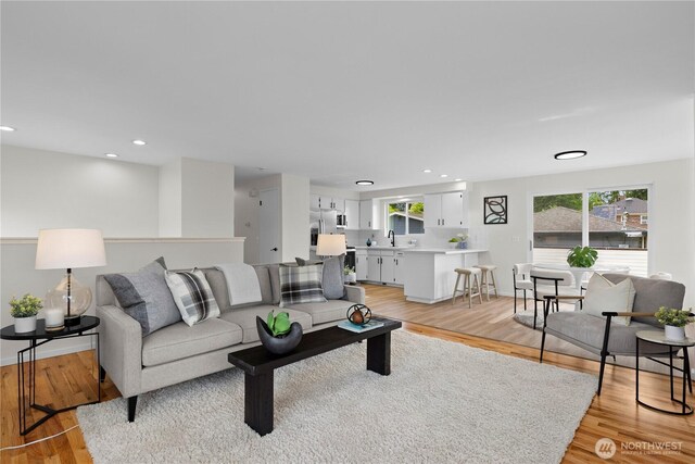 8716 Main St, Edmonds, WA 98026 - living area with light wood-type flooring and recessed lighting
