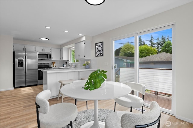 8716 Main St, Edmonds, WA 98026 - dining space with light wood-style floors and recessed lighting