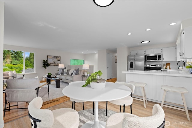 8716 Main St, Edmonds, WA 98026 - dining space featuring light wood-style floors and recessed lighting