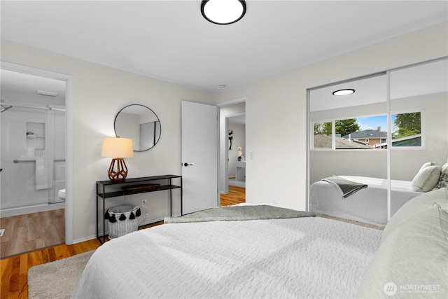 8716 Main St, Edmonds, WA 98026 - bedroom with wood finished floors and connected bathroom