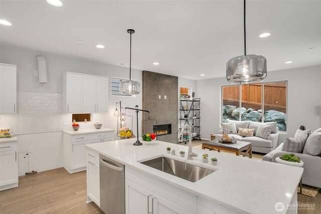 8112 131st Pl SE Unit 15, Snohomish, WA 98296 - kitchen with a sink, stainless steel dishwasher, open floor plan, white cabinetry, and recessed lighting