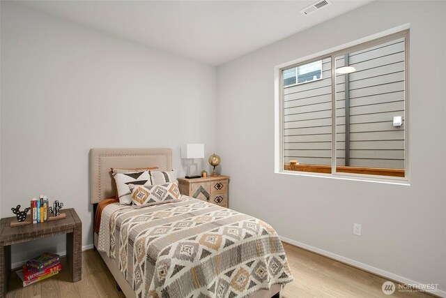 8112 131st Pl SE Unit 15, Snohomish, WA 98296 - bedroom featuring wood finished floors and baseboards