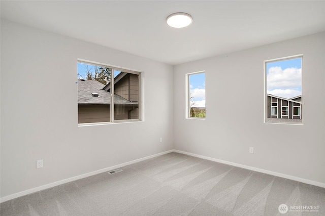 8112 131st Pl SE Unit 15, Snohomish, WA 98296 - spare room featuring baseboards and carpet