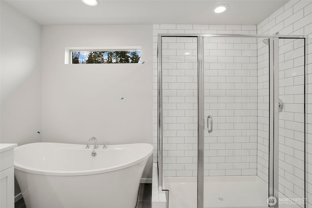 8112 131st Pl SE Unit 15, Snohomish, WA 98296 - full bath with a stall shower, a soaking tub, recessed lighting, and vanity