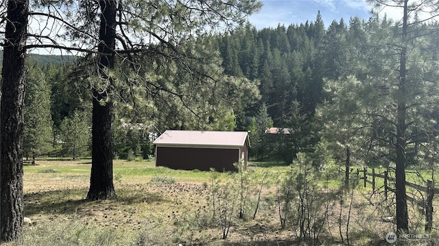 26 Newby Creek Rd, Twisp, WA 98856 - view of yard with a view of trees and an outdoor structure