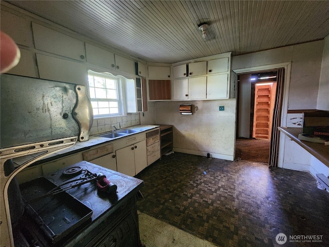 175 Stevens Rd, Chehalis, WA 98532 - kitchen with white cabinetry, a sink, dark flooring, wood ceiling, and range