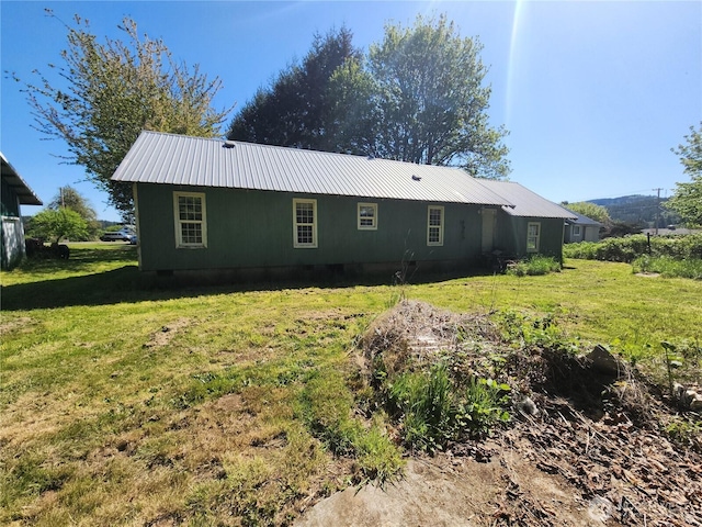 175 Stevens Rd, Chehalis, WA 98532 - rear view of house with metal roof and a lawn